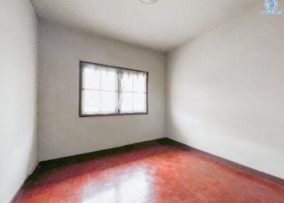 Simple empty bedroom with a window