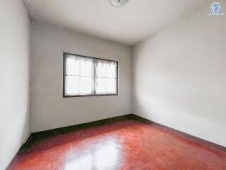 Simple empty bedroom with a window