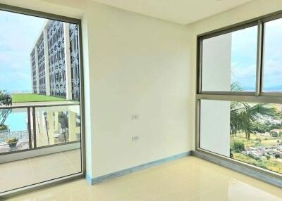 Bright and airy living room with large windows and balcony access