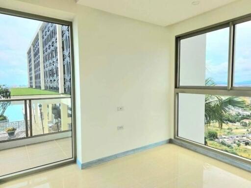 Bright and airy living room with large windows and balcony access