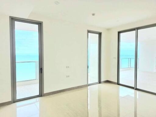 Bright living room with large windows and balcony access