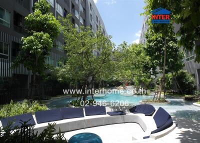 Outdoor seating area with garden and pool