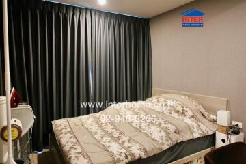 Bedroom with bed and dark curtains