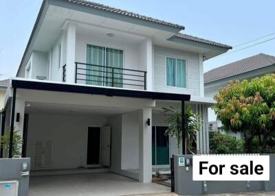 Two-story house with a carport and 