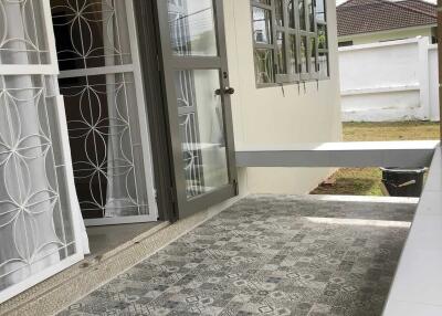 Patio with tiled floor and garden view