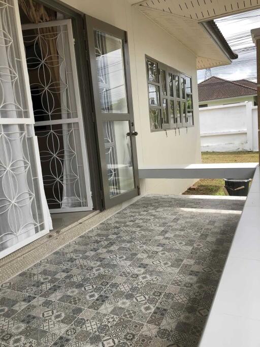 Patio with tiled floor and garden view