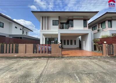 Modern two-story house with a gated compound