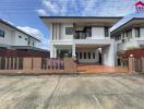 Modern two-story house with a gated compound