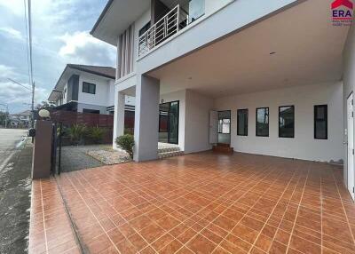 Exterior view showing carport and modern house facade