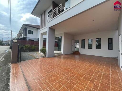 Exterior view showing carport and modern house facade