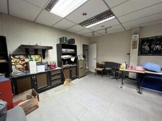 A spacious utility room with shelves and storage