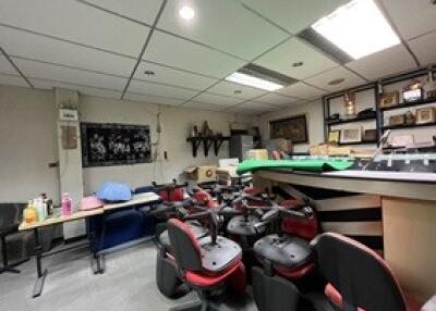 Basement space with office chairs and assorted items