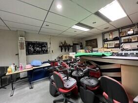 Basement space with office chairs and assorted items