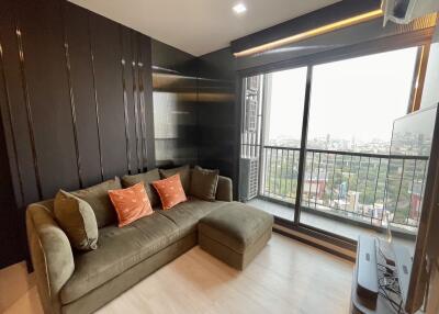 Modern living room with large window and city view