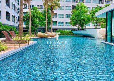 Outdoor swimming pool with surrounding buildings