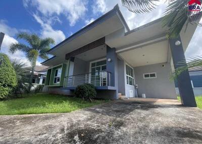 Front view of a modern house with garden