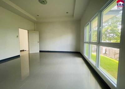 Spacious and well-lit living room with large windows