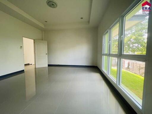 Spacious and well-lit living room with large windows