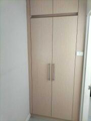 Bedroom closet with wooden doors