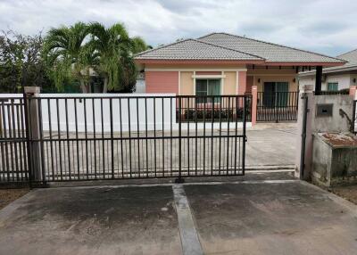 House exterior with front yard and gate