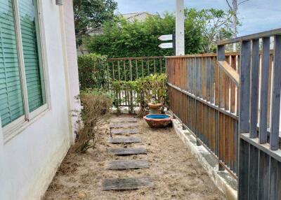 Walkway and garden area beside the house