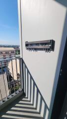 Balcony with a view and a wall-mounted rack