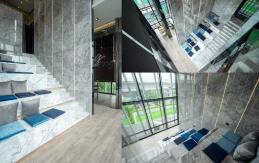 Modern building interior with marble stairs and seating area