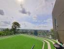 Rooftop view with artificial grass and panoramic cityscape