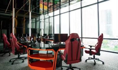 Modern office space with large windows and ergonomic chairs