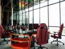 Modern office space with large windows and ergonomic chairs