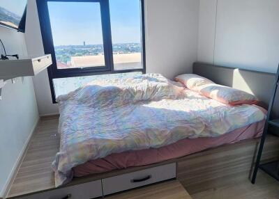 Modern bedroom with a platform bed and large window