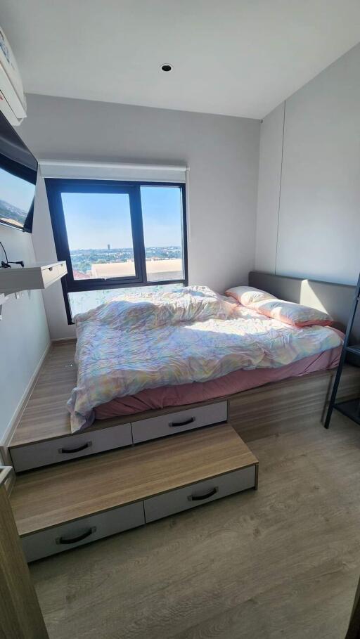 Modern bedroom with a platform bed and large window