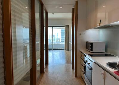 Modern galley kitchen with city view in distance