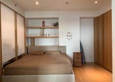 Cozy modern bedroom with double bed and wardrobe