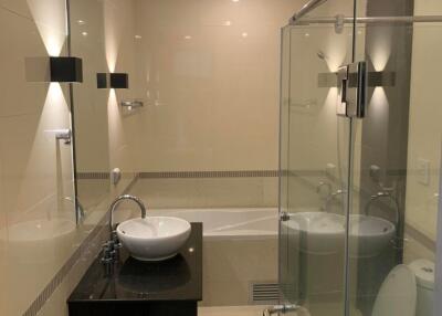 Modern bathroom with glass shower and stylish fixtures