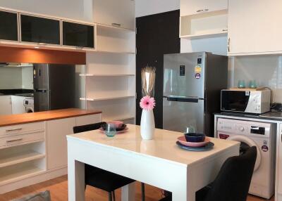 Modern kitchen with appliances and dining table