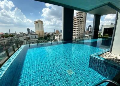 Rooftop swimming pool with a city view