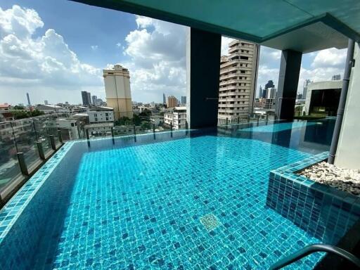 Rooftop swimming pool with a city view