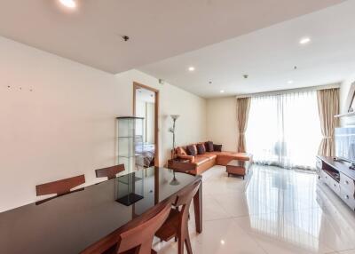 Modern living room with dining area and brown sofa