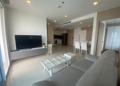 Spacious living area with modern furnishings and open-concept design.