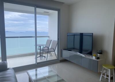 Living room with a view of the balcony and sea