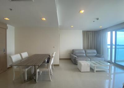 Modern living room and dining area with large windows