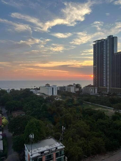 City skyline with high-rise buildings at sunset