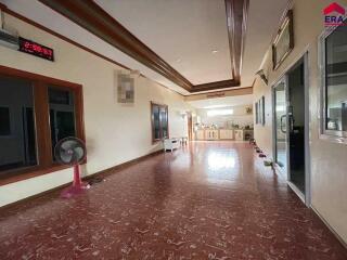 Spacious living area with kitchen view