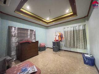 Spacious room with furniture and clothing storage