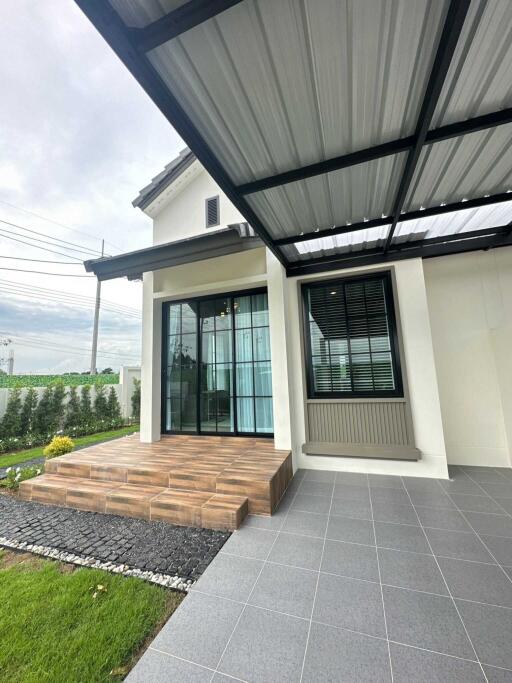 Front entrance of a modern house with a covered porch