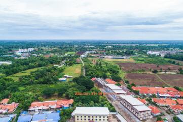 Aerial view of residential area with surrounding greenery