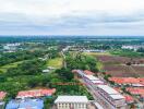 Aerial view of residential area with surrounding greenery