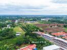 Aerial view of a residential area and surrounding landscape