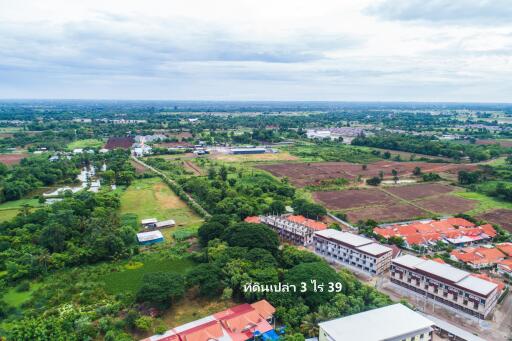 Aerial view of a residential area and surrounding landscape